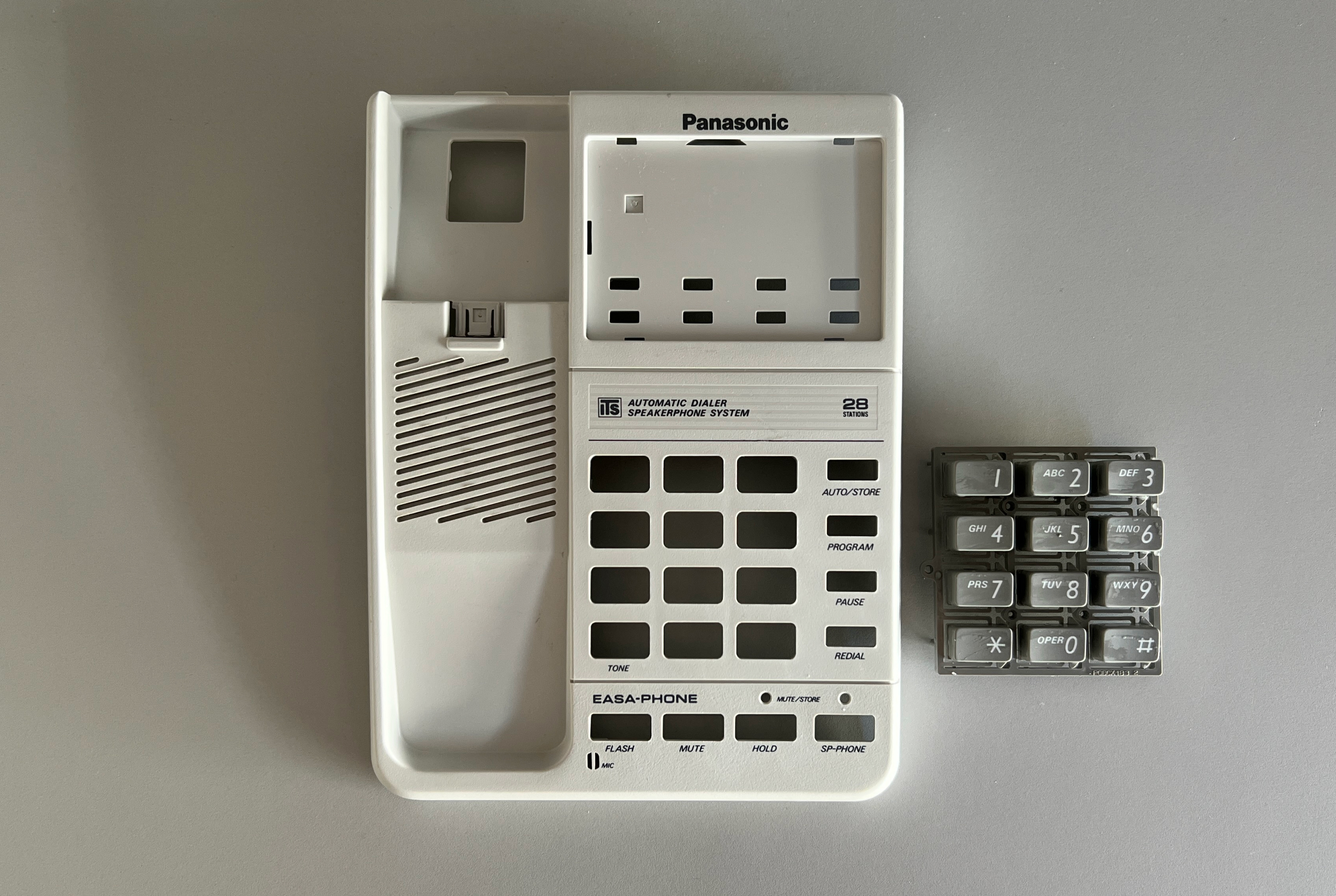 Panasonic phone with new gray curly handset cable installed