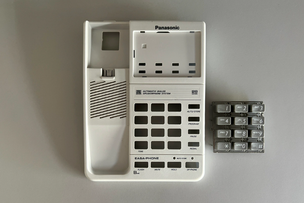 Panasonic phone with new gray curly handset cable installed