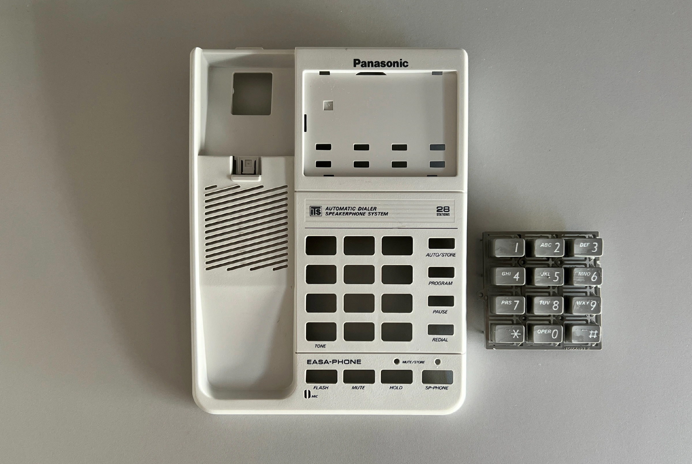Panasonic phone with new gray curly handset cable installed