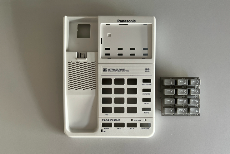 Panasonic phone with new gray curly handset cable installed