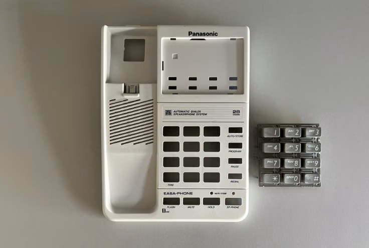 Panasonic phone with new gray curly handset cable installed